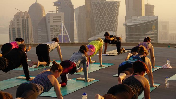 sunset yoga shangri la doha helipad global wellness day